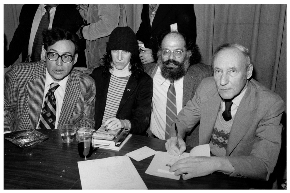 Beats in 1977 (left to right): Carl Solomon, Patti Smith, Allen Ginsberg, William S. Burroughs. Image via Wiki Commons