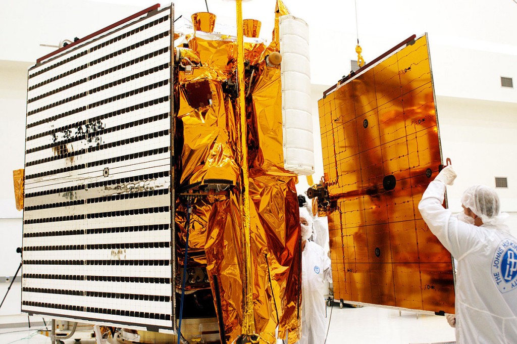 Technicians install solar panels on NASA's MESSENGER spacecraft. Photo Credit: Public Domain