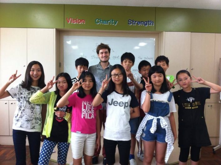 Posing with my sixth grade students in South Korea during the last week of my year of teaching abroad.